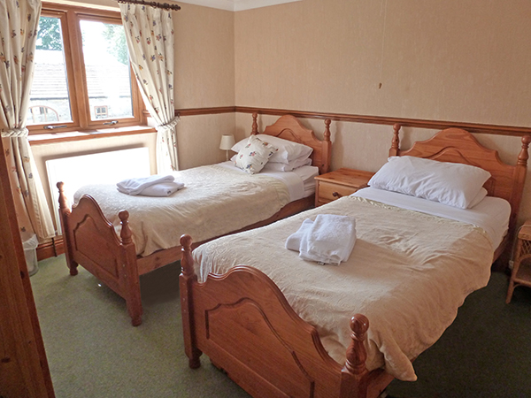 Ashwood Lodge's Bedroom 2 has an en suite shower room. It is a twin room as standard, but can become a triple room upon request.